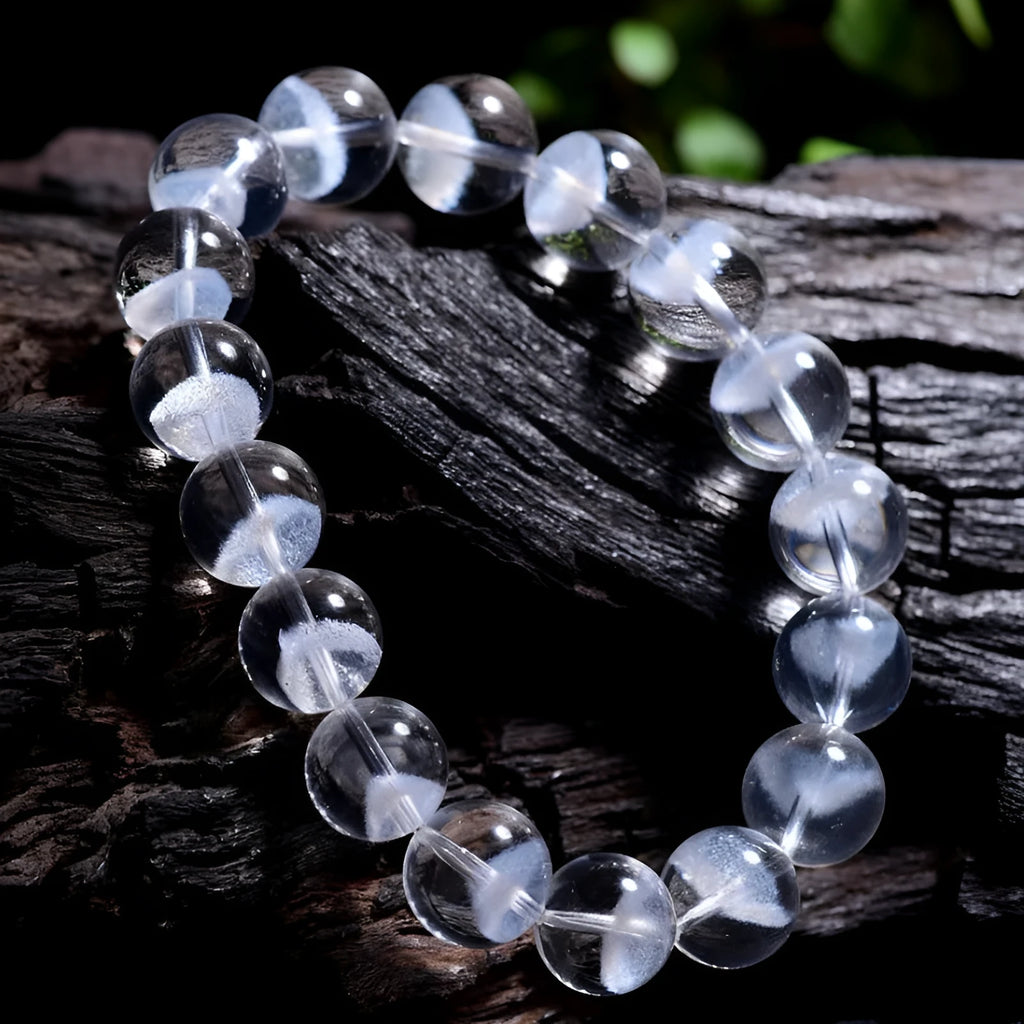 Women's white crystal pyramid bracelet with Ruyi charm in natural ghost colour showing geometric beads