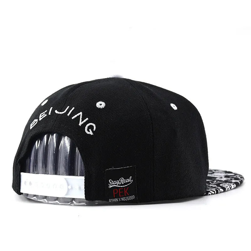 Cotton baseball cap with embroidered letters, adjustable strap, in black or white