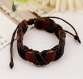 Asgard crafted leather Nordic arm bracelet in brown cowhide with black hemp rope adjustable fit