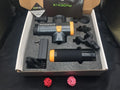 ABS plastic percussion massage gun with four interchangeable massage heads for deep tissue therapy