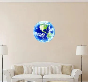 Glow in the dark 3D Earth planet wall sticker in multiple sizes on a dark wall.