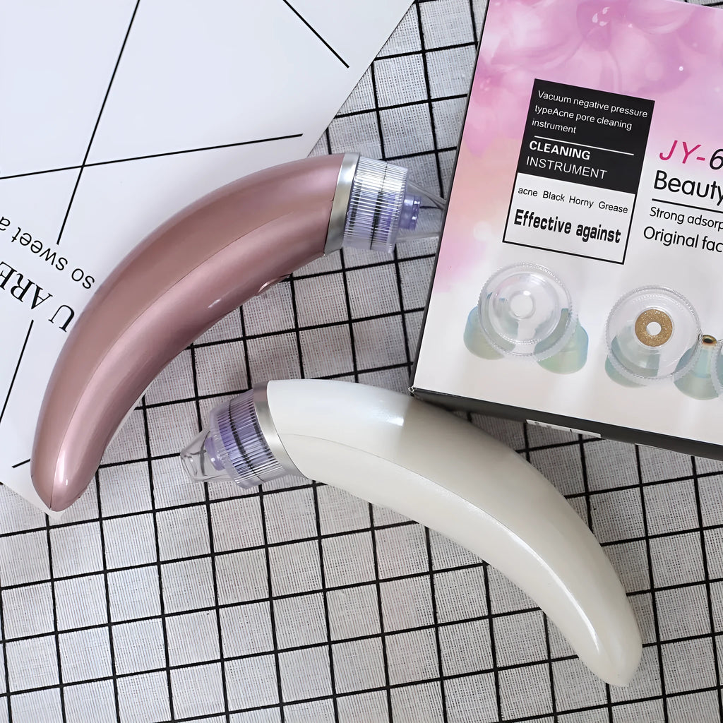 JY-666 electric pore cleanser in rose gold and white colours with suction tips for facial blackhead removal