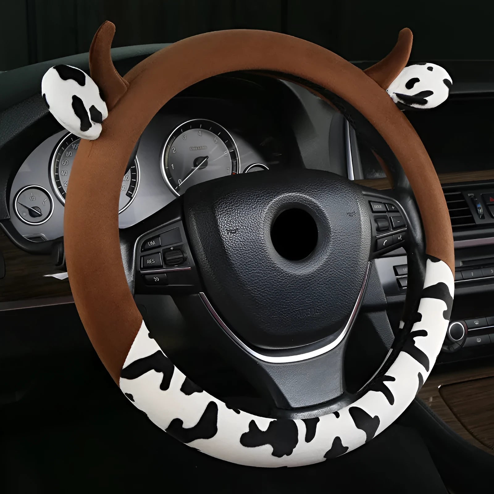 Short plush automotive steering wheel cover in black, showing protective handle detail.