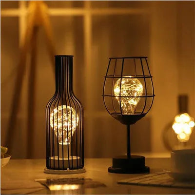 Minimalist hollow iron table lamp with warm white LED light in red wine bottle style