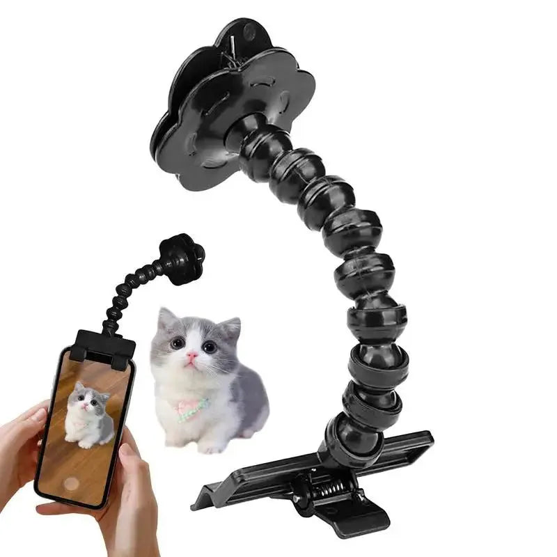 Black pet photography tool with a clip for holding treats and a phone holder on a rotating support