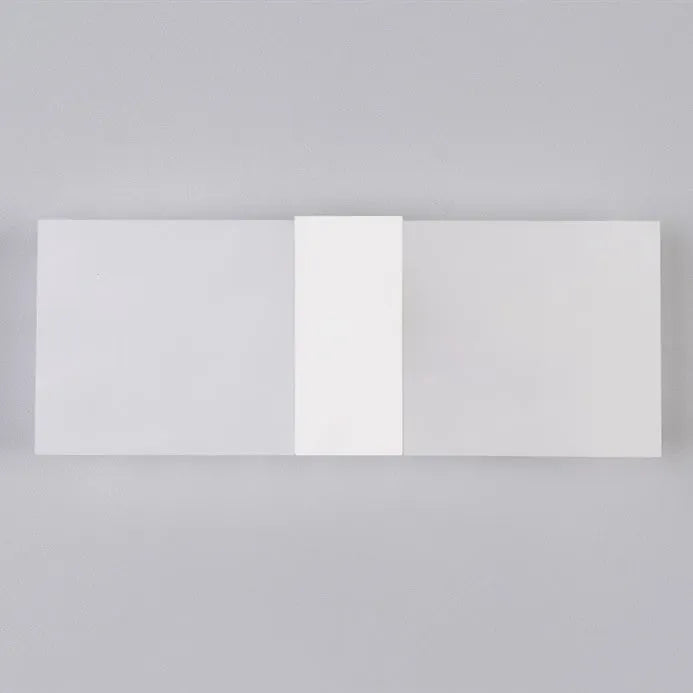 Modern acrylic LED wall lamp in black finish mounted on a corridor wall measuring 27x10cm