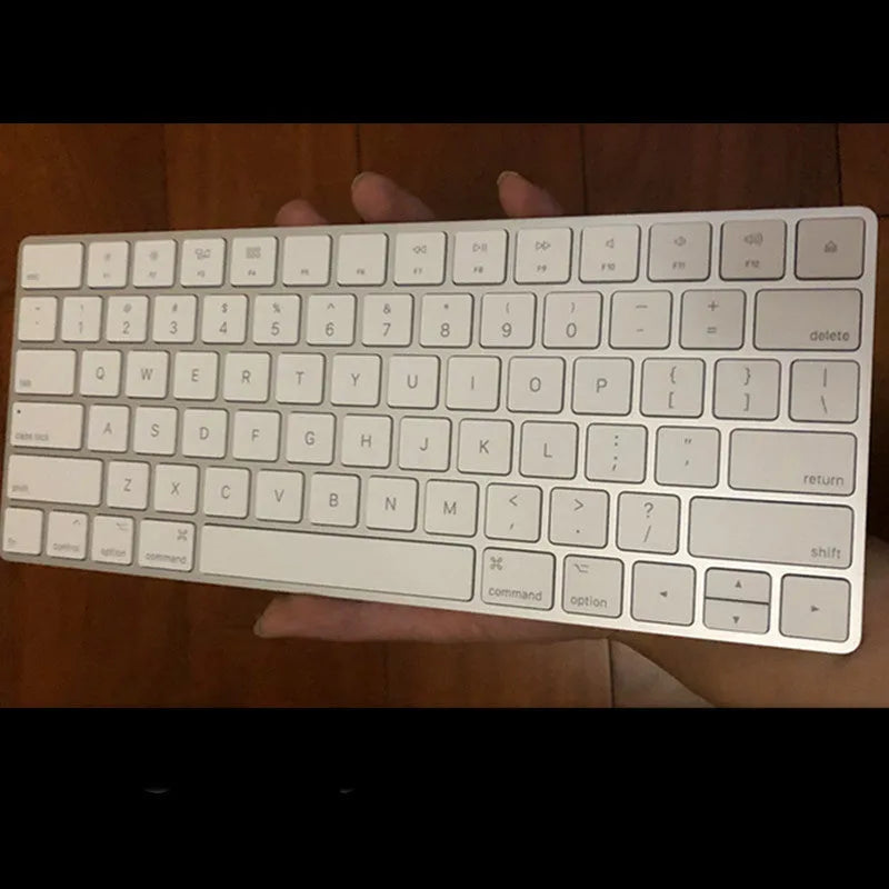 White Apple G6 Bluetooth keyboard with ultra-thin metal casing and multimedia keys