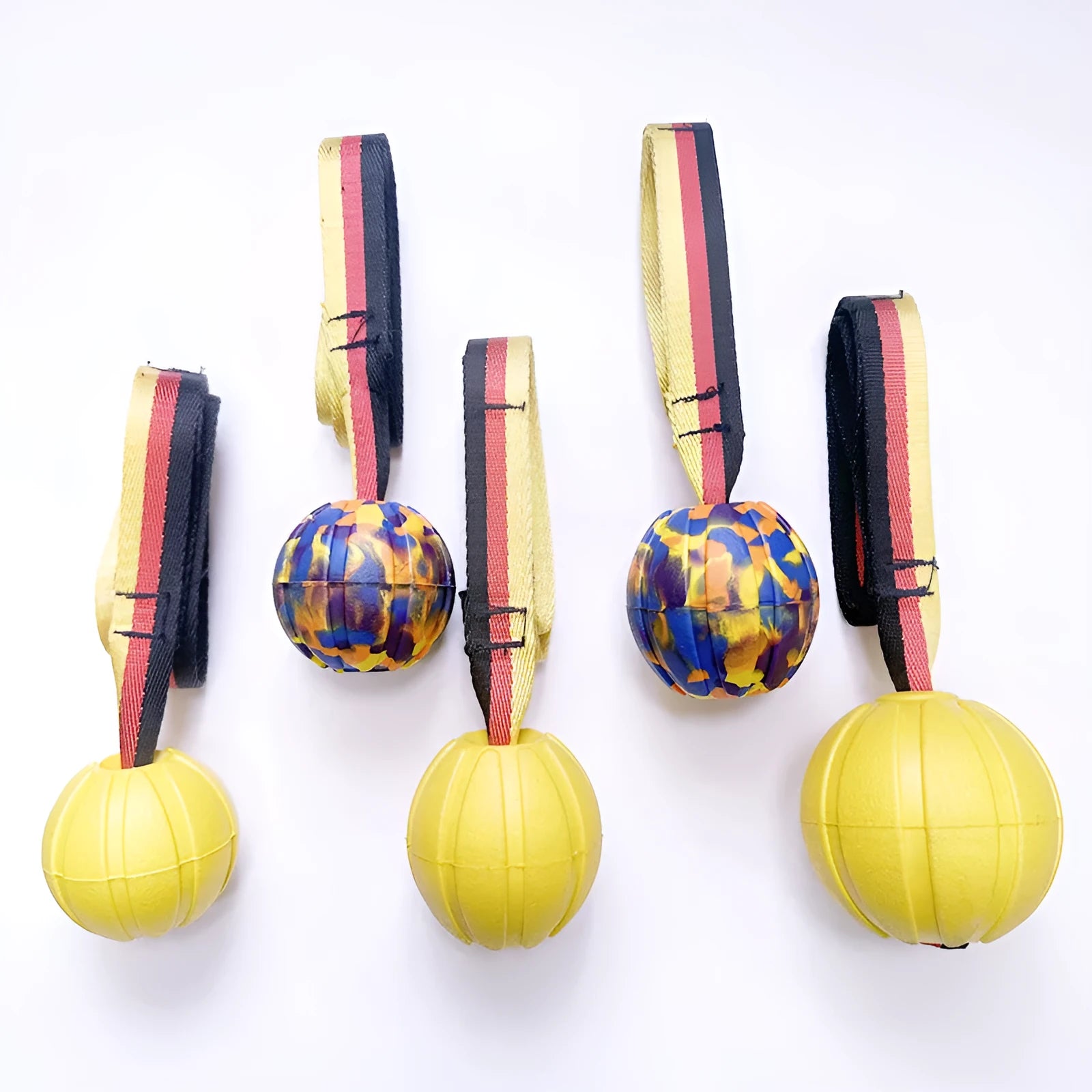 EVA floating dog training ball in camouflage and yellow colours showing three different diameter sizes