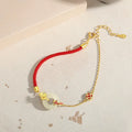 Women's gold electroplated 925 silver koi fish peace buckle bracelet with adjustable red rope