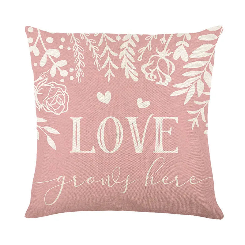 Red and black plaid heart printed square pillow cover on a sofa.