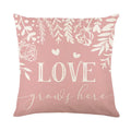 Red and black plaid heart printed square pillow cover on a sofa.