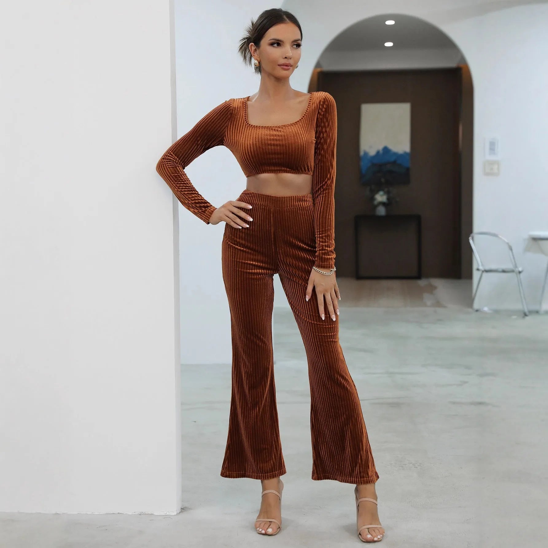 Caramel-coloured long sleeve sweater set with matching top and trousers on hanger