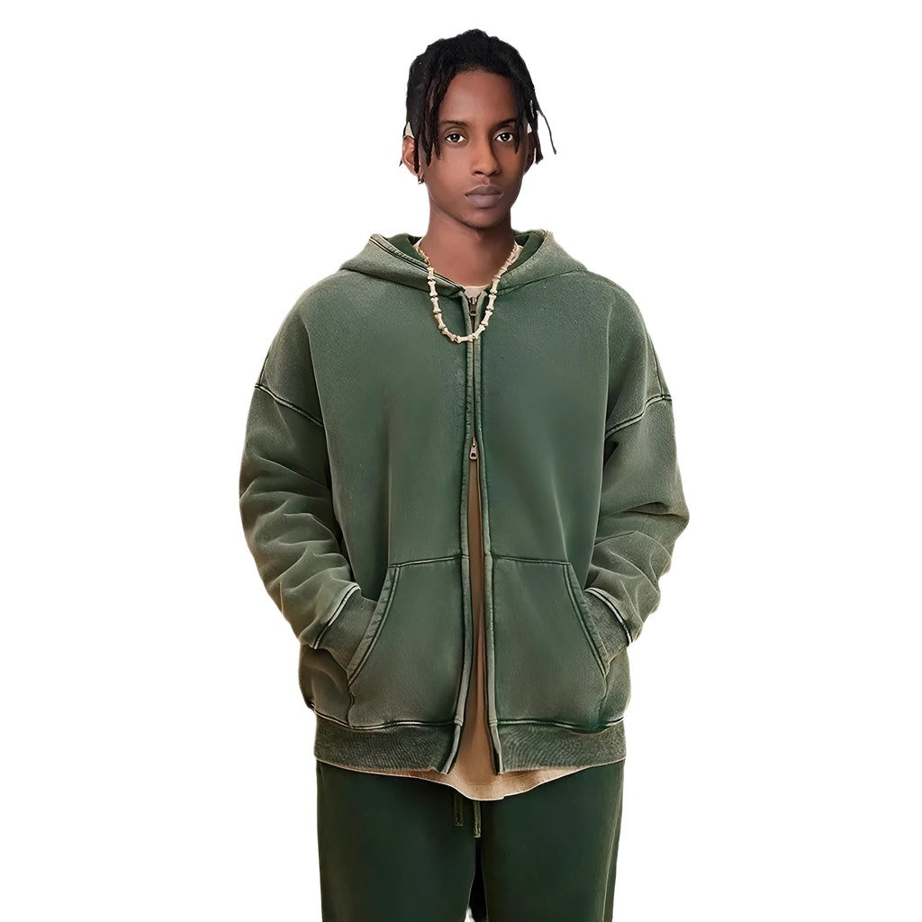 Man wearing a washed black fleece-lined hooded cardigan with a double zipper