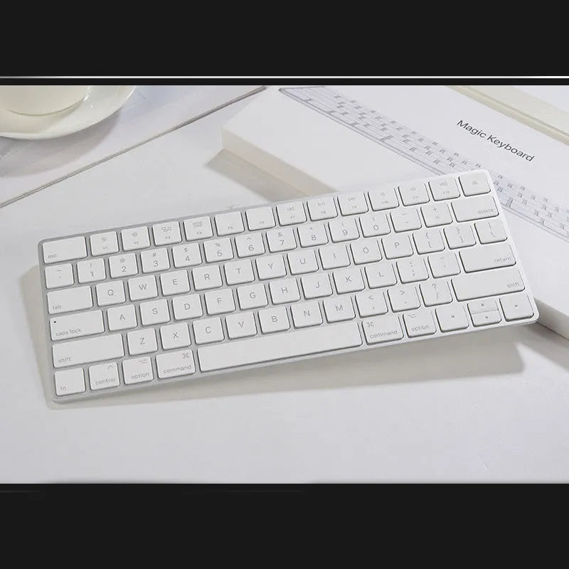 White Apple G6 Bluetooth keyboard with ultra-thin metal casing and multimedia keys