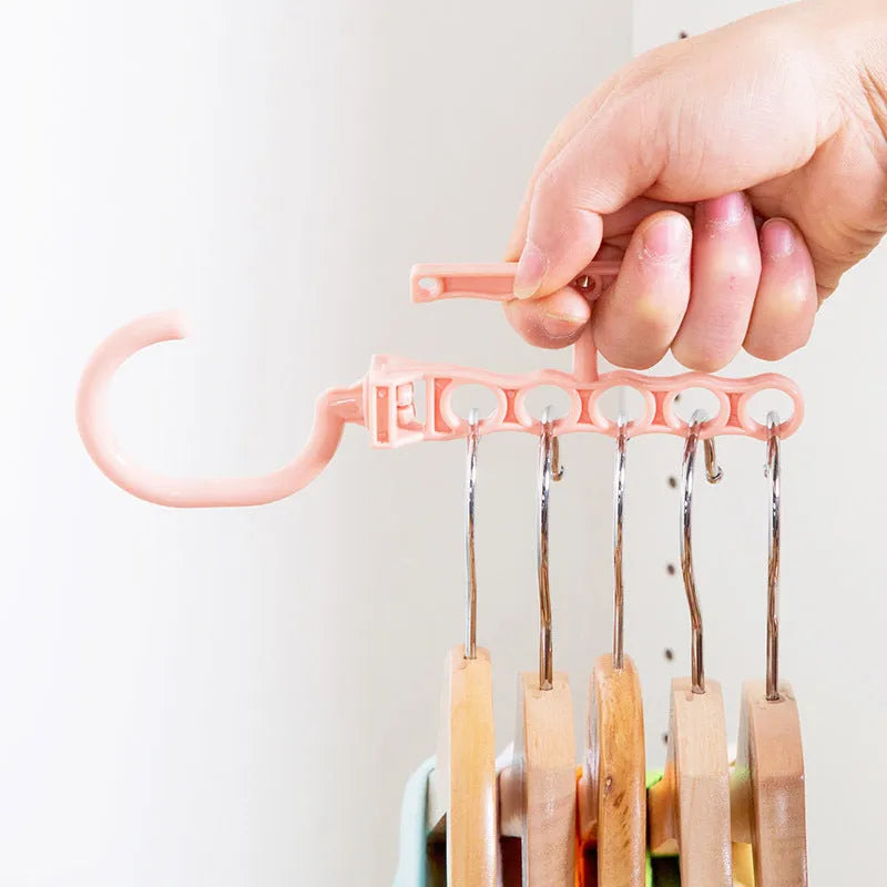 Blue magic wardrobe hanger with five branches and a top handle for organising clothes.