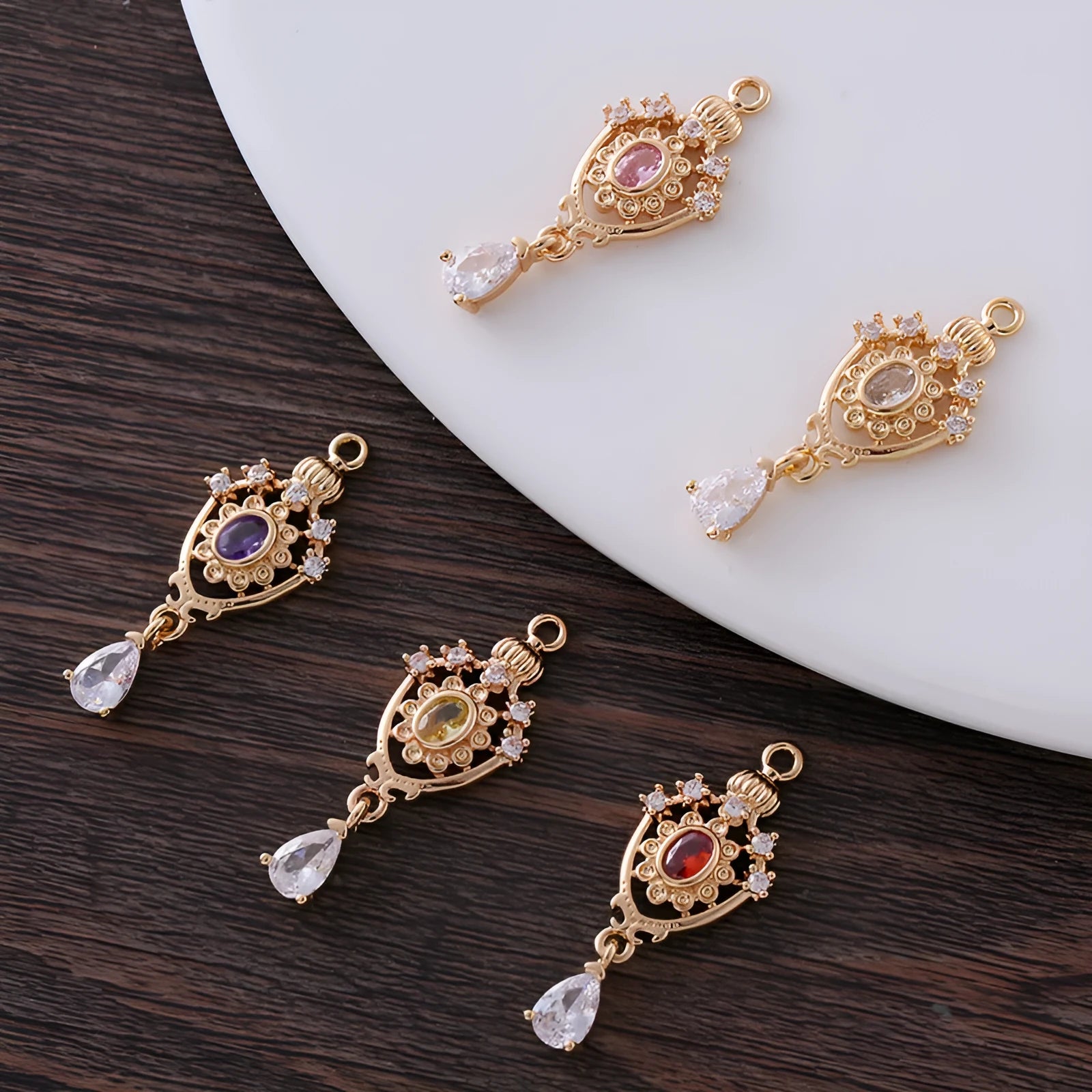 Small water drop pendant with hollow crown design and zircon accents in five colour options