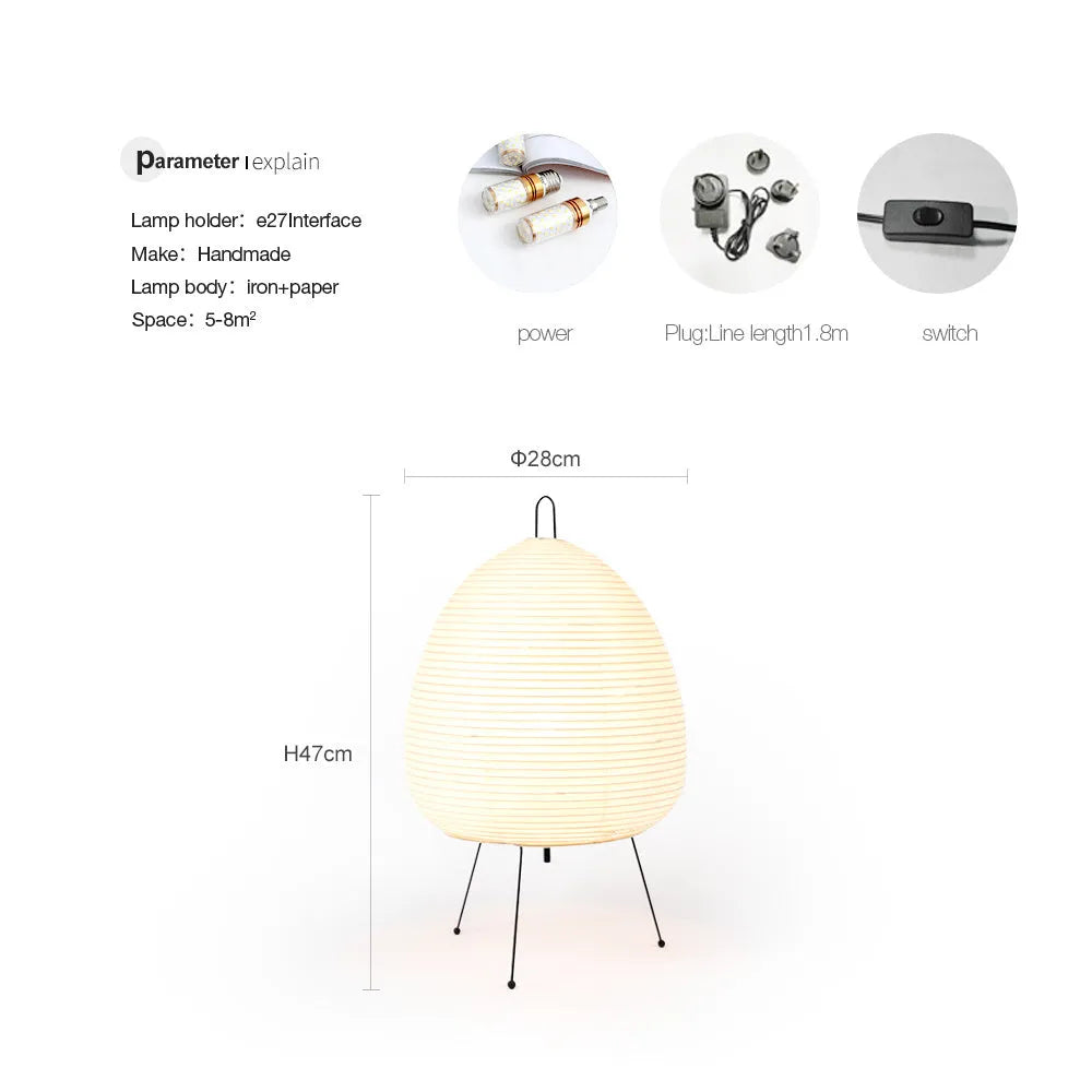 Japanese style rice paper table lamp with aluminium base on a wooden table.