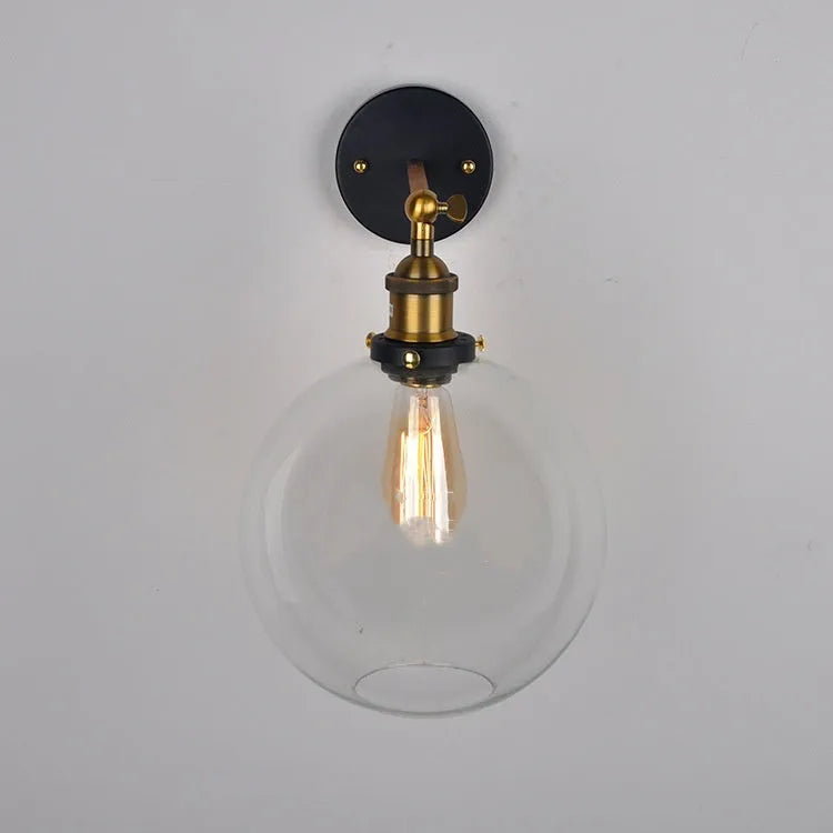 Retro round glass wall lamp with aluminium holder, shown in amber, smoky grey, and transparent finishes.