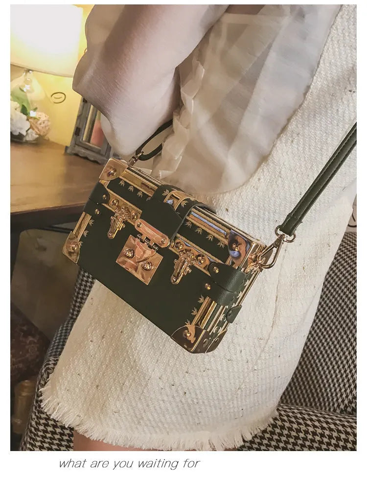 Hard structured women's shoulder bag in PU leather with single strap and flap design