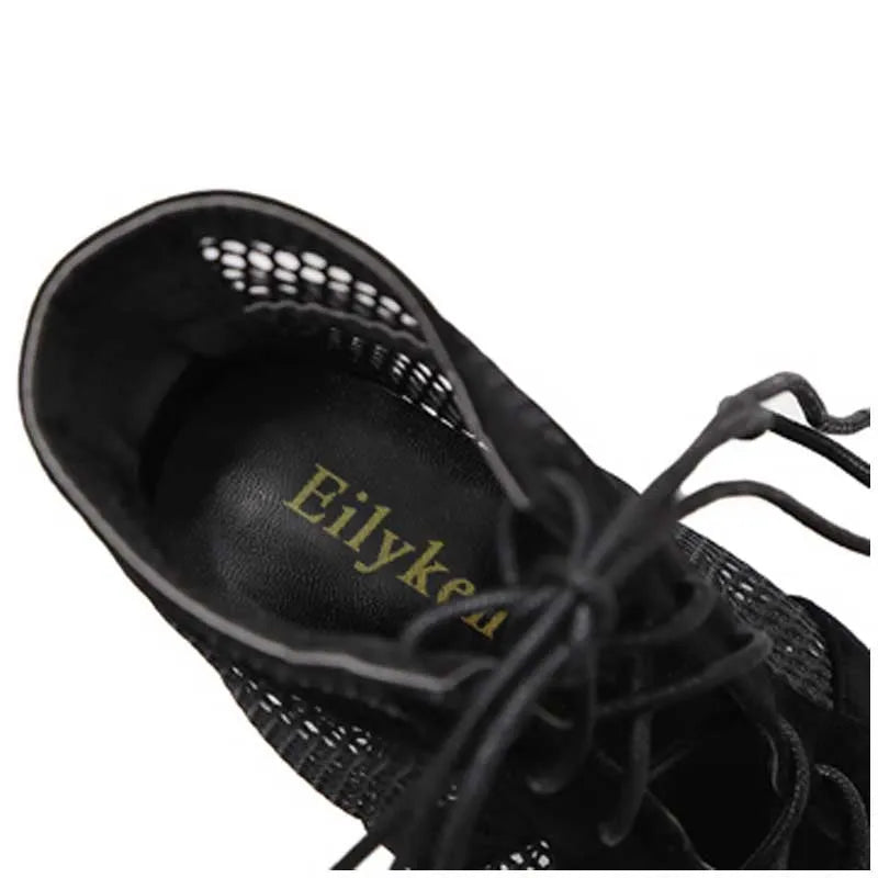 Black suede women's high-heel shoes with lace-up front and stiletto heel