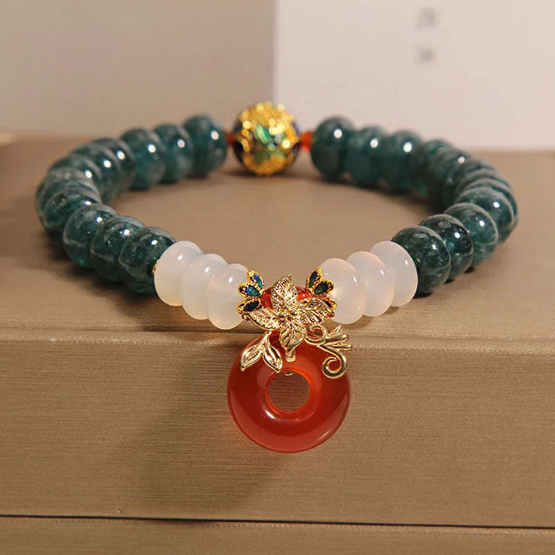 Women's blue water jade and red agate crystal bracelet with peace buckle closure