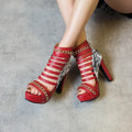 Women's black fish mouth Roman high-top shoes with snake skin texture and a thick block heel.