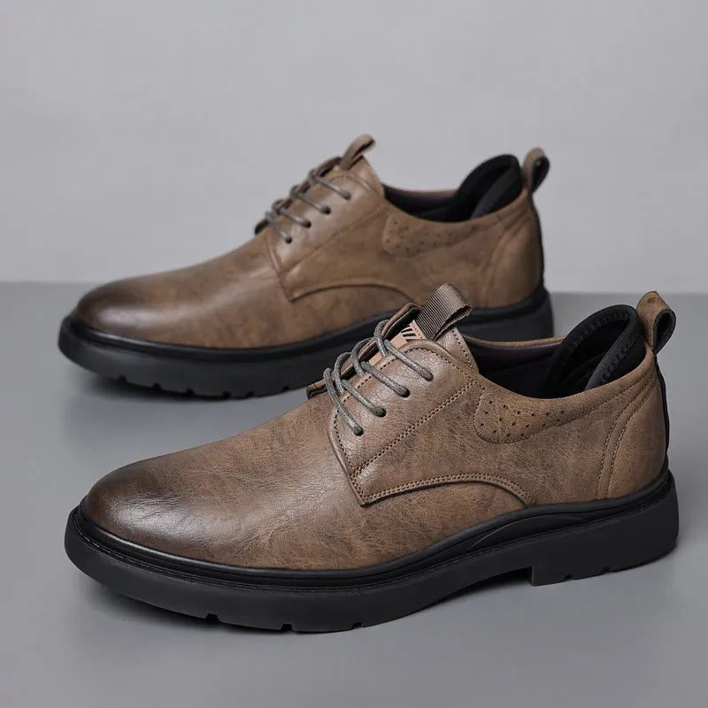 Men's black and brown leather casual sneakers with decorative stitching and a rubber sole.