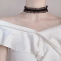 Velvet ruffled clavicle necklace with floral alloy pendant on snake bone chain in black colour