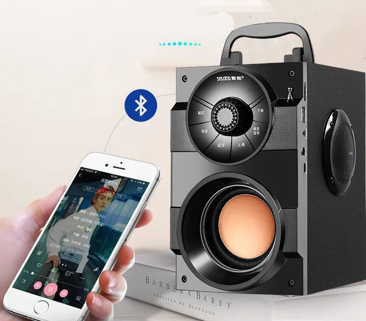 Black portable mini audio system with satellite speakers and subwoofer, 3.5mm cable, and USB power input.