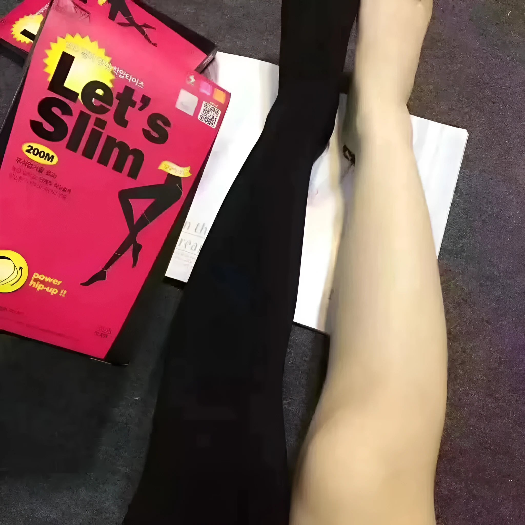 Beige and black stovepipe socks made from polyester for lifting hips and abdomen, shown in one-size fit.