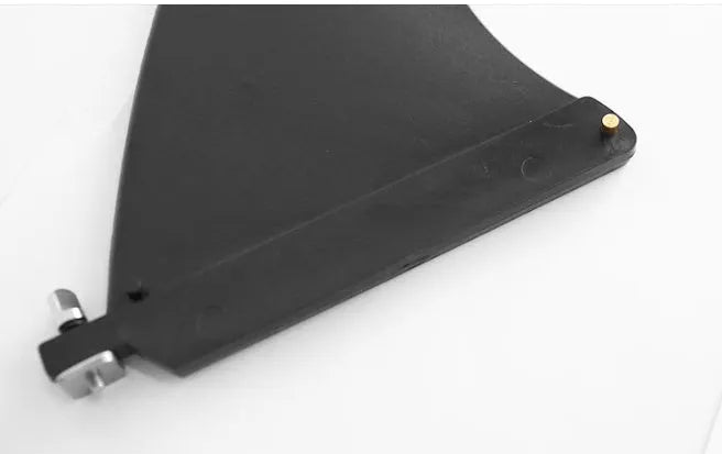 SUP paddle with large removable plastic fish fins showing screw attachment system