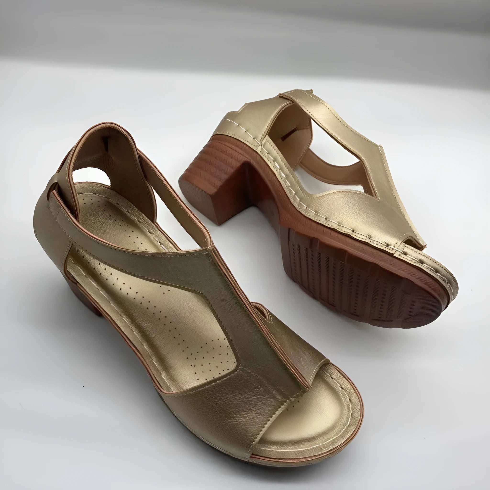 Women's beige peep toe wedge sandals with a buckle ankle strap and low rubber sole.