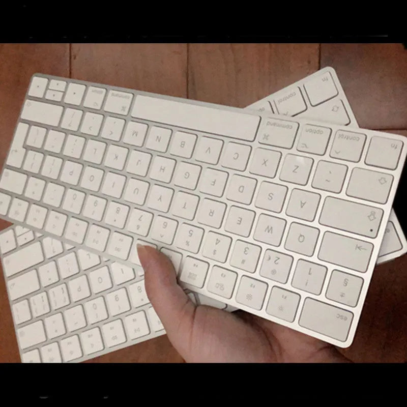 White Apple G6 Bluetooth keyboard with ultra-thin metal casing and multimedia keys