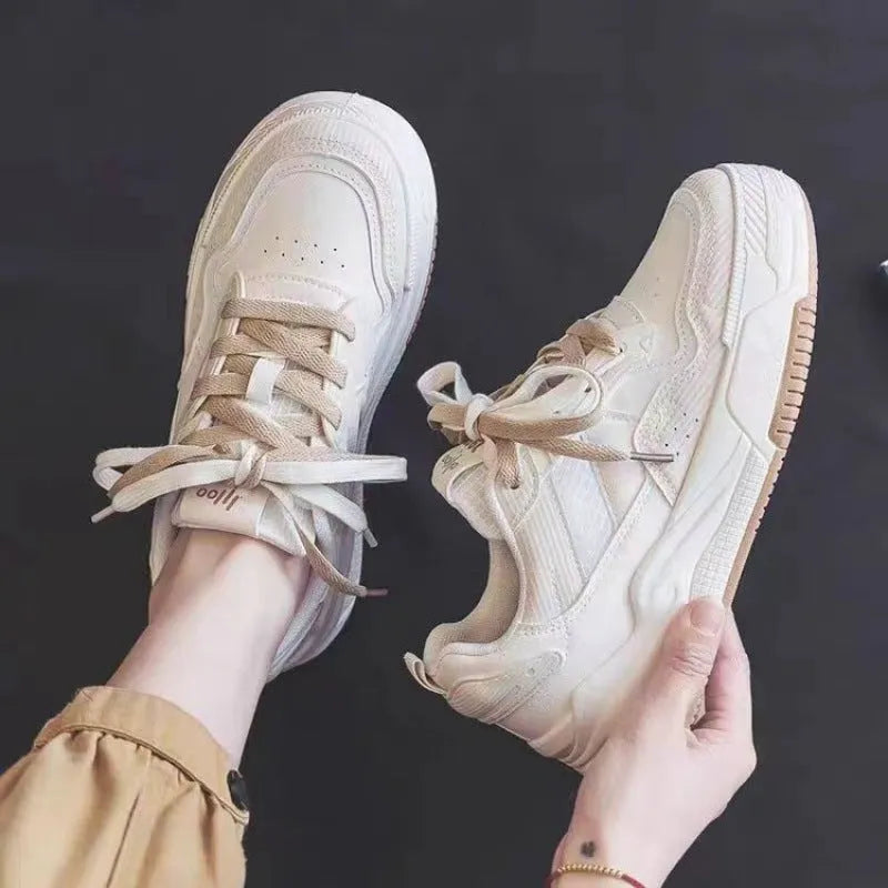 Pink and milky white low-top rubber sole sneakers with height increasing function