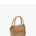 Wing-shaped women's leather handbag with latch closure and cross-body strap in available colours.