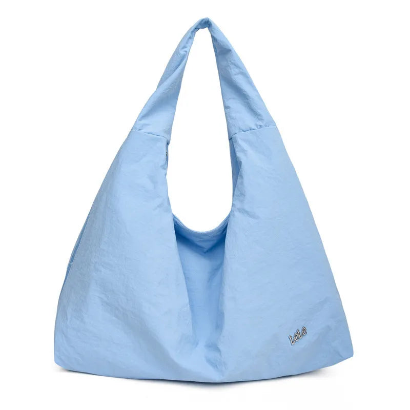 Women's heart-shaped nylon underarm bag in black, blue, khaki, and yellow colour options showing large capacity design