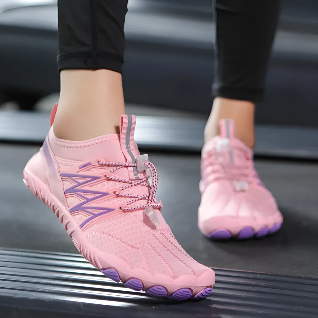Indoor fitness training shoes in striped design with low-top profile and rubber sole.