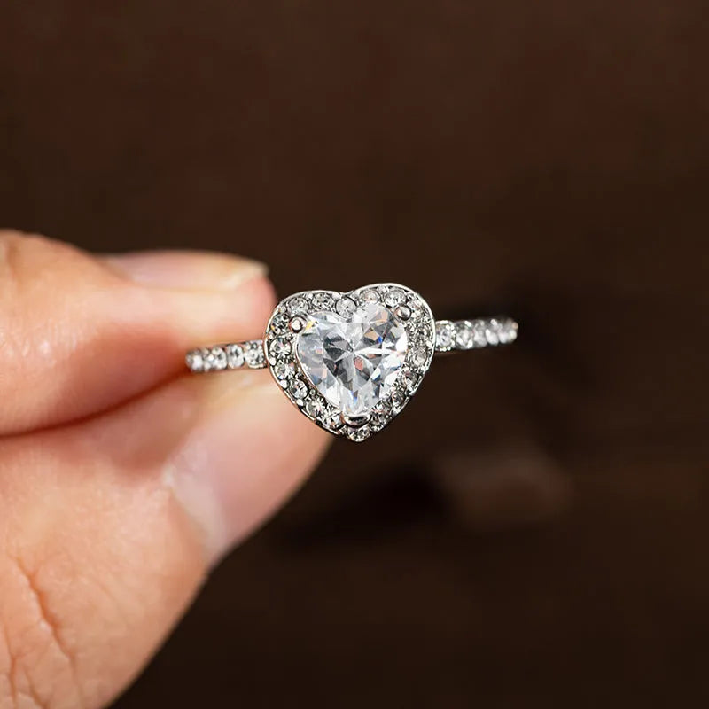 Heart-shaped crystal wedding ring with electroplated rose gold finish on white copper band