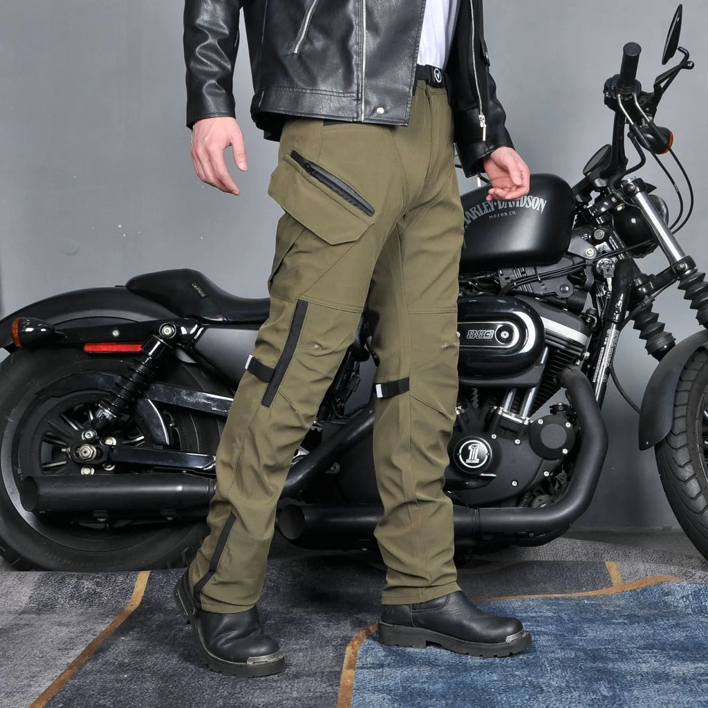 Man's black waterproof motorcycle cycling pants with adjustable belt laid flat.