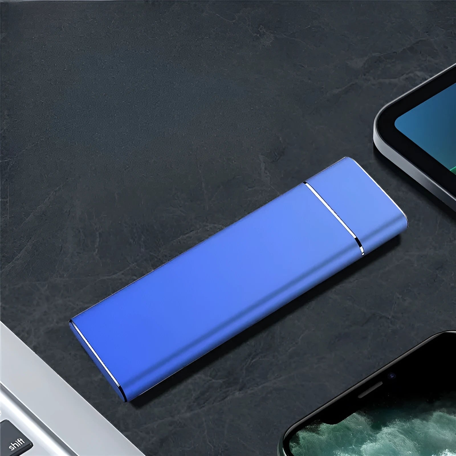 Sapphire blue metal external hard drive with USB cable on a white surface.
