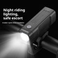 USB rechargeable bicycle headlight mounted on handlebars with quick release strap bracket