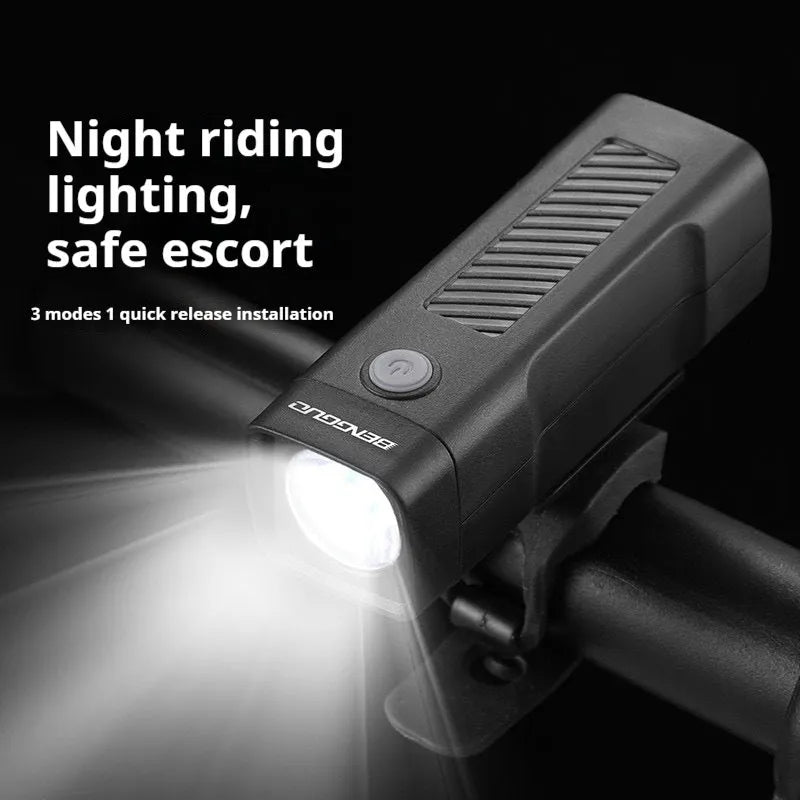 USB rechargeable bicycle headlight mounted on handlebars with quick release strap bracket