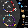 Two natural stone beaded bracelets with elastic cord, showing zodiac sign styles.
