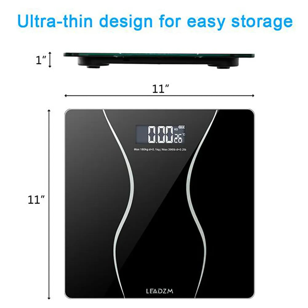 Black electronic bathroom scale with digital display on tempered glass platform