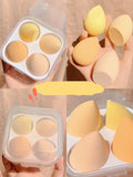 Box containing four coloured makeup egg sponges in Grape, Mango, Mint, and Peach.