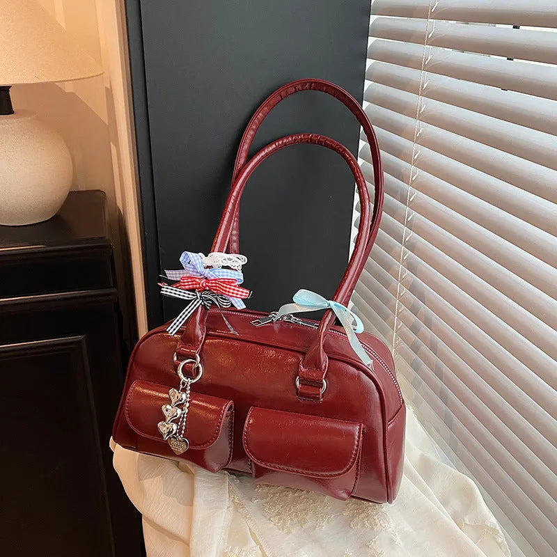 Retro PU leather pillow bag with one-shoulder design and double straps in black colour