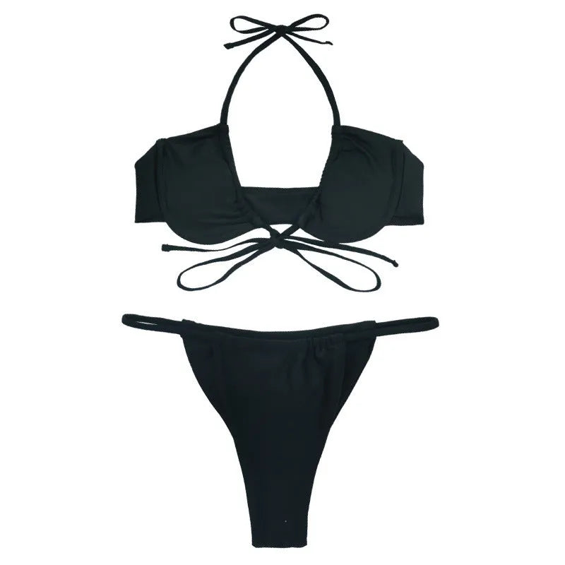 Women's black and mint green two-piece nylon bikini set showing front view.