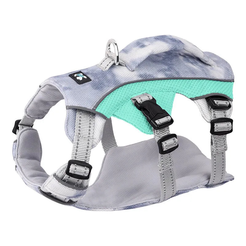 Reflective light blue dog cooling vest with chest strap on a medium-sized dog