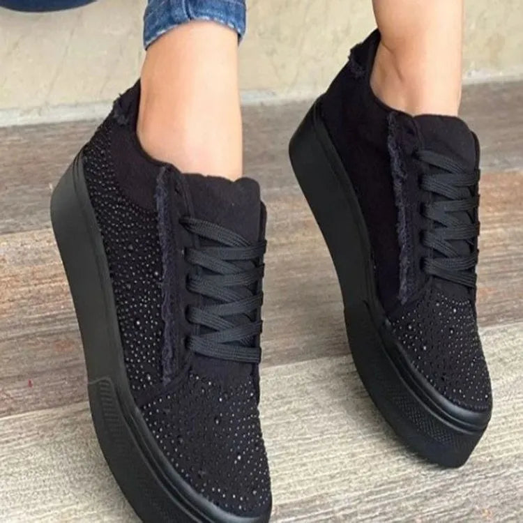 Plus size women's low-top lace-up casual shoes with rhinestone detail and a thick rubber sole, in black.