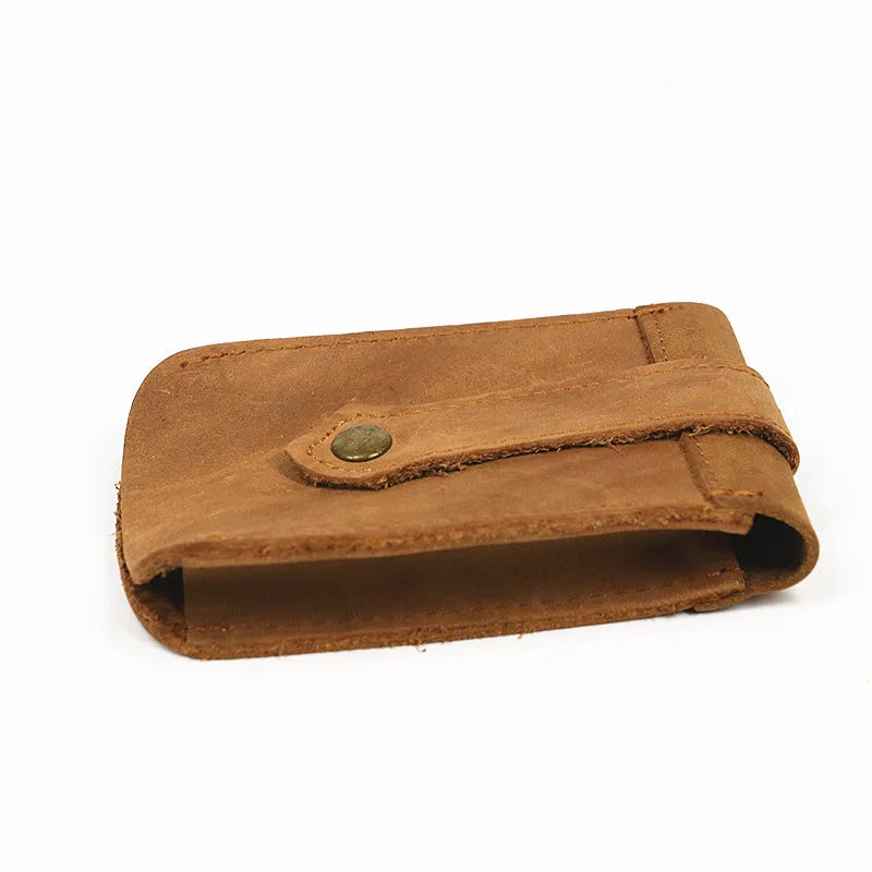 Crazy horse leather key case in dark brown, 7cm by 11.5cm, resting on a surface